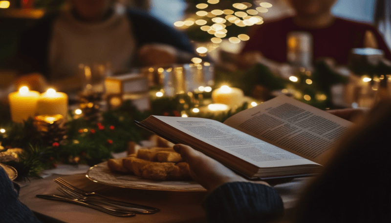 Libri per Natale: una persona legge durante il cenone